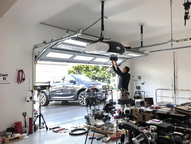 Norwalk Garage Door Repair specialist installing smart garage door opener system in Norwalk home