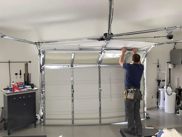Norwalk Garage Door Repair specialist performing precise section replacement on Norwalk garage door